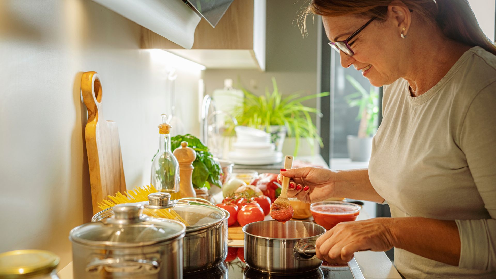 Woman cooking food on the stove