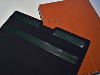 Some adhesive strips hold the Folio in place.