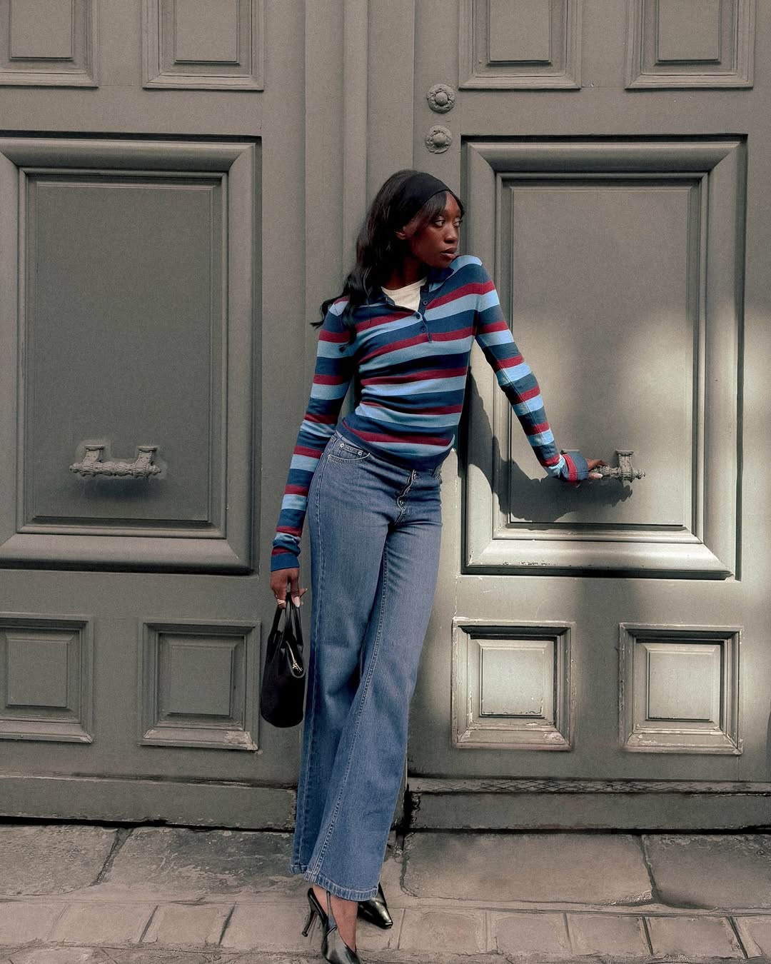 Emmanuelle in jeans and a striped top