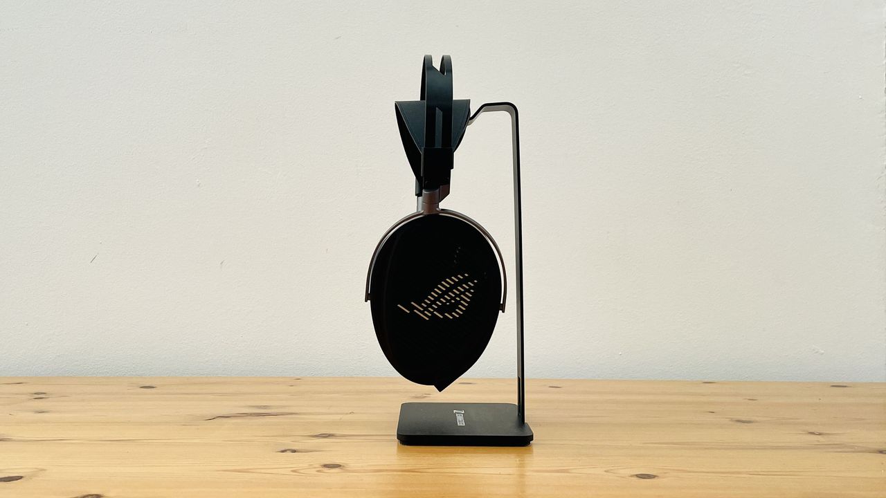 A picture of the Asus ROG Kithara audiophile wired gaming headset on a wooden surface.