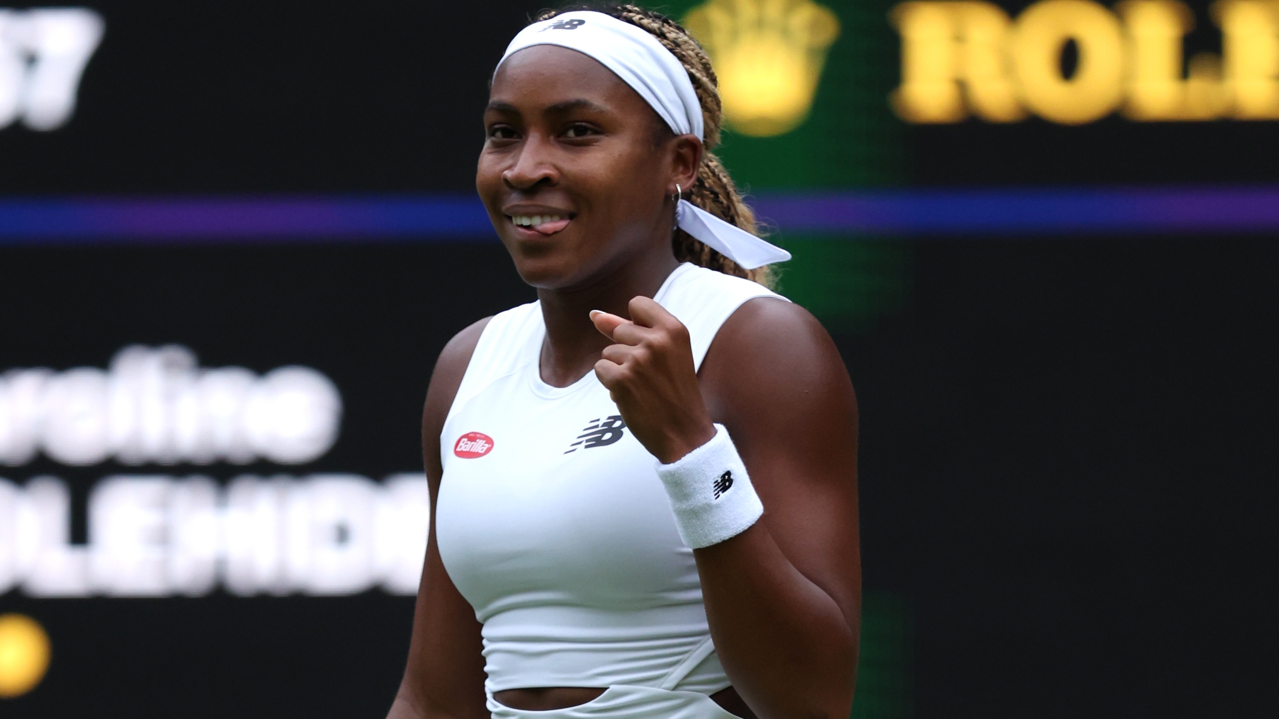 Coco Gauff clenches her fist in victory at Wimbledon ahead of