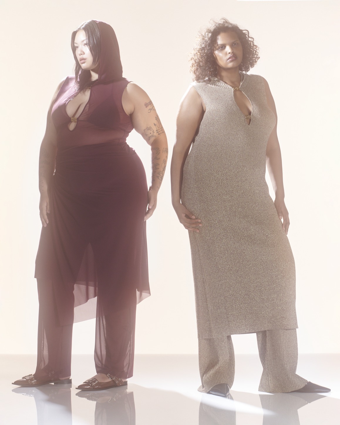 Ganni x Paloma Elsesser Campagin Photography featuring two dresses, each worn over pants