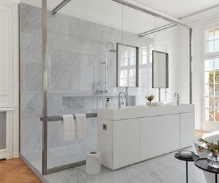 bathroom with marble finish and French windows