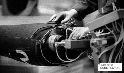 Male making a pair of trousers using a machine