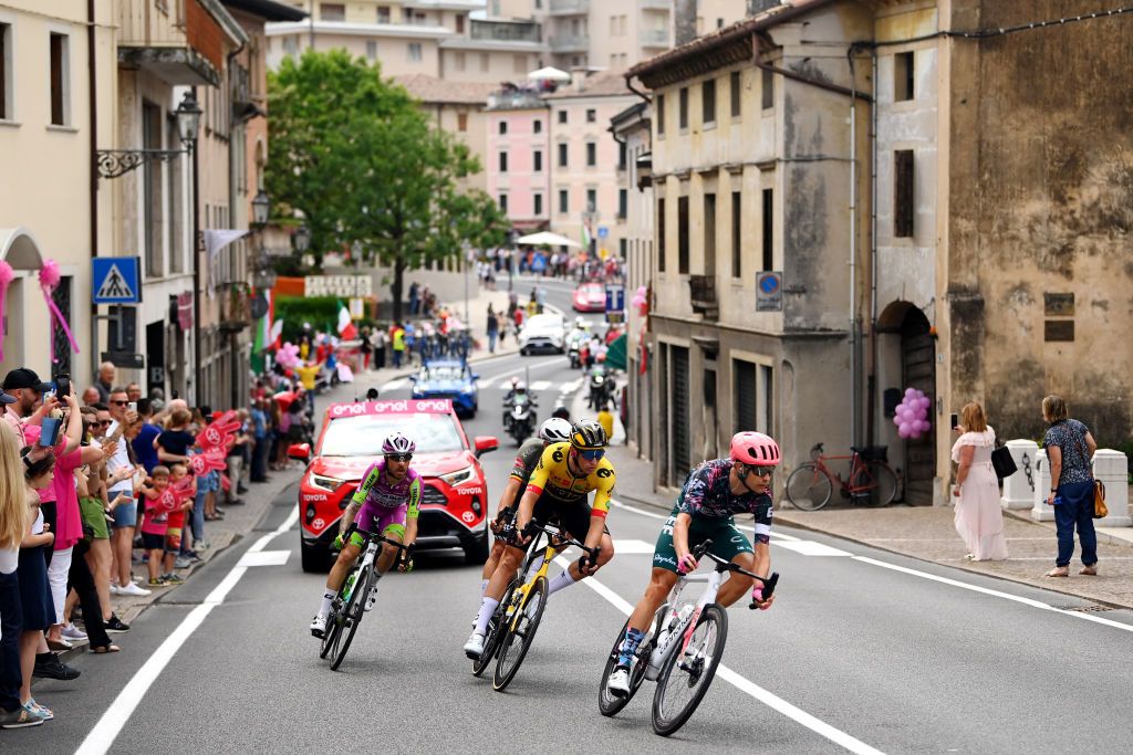 TREVISO ITALY MAY 26 A general view of Magnus Cort Nielsen of Denmark and Team EF Education Easypost Davide Gabburo of Italy and Team Bardiani CSF Faizane Dries De Bondt of Belgium and Team Alpecin Fenix and Edoardo Affini of Italy and Team Jumbo Visma competing in the breakaway through Pieve di Soligo city landscape while fans cheer during the 105th Giro dItalia 2022 Stage 18 a 156km stage from Borgo Valsugana to Treviso Giro WorldTour on May 26 2022 in Treviso Italy Photo by Tim de WaeleGetty Images