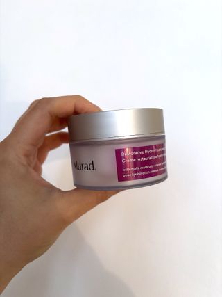 Mica Ricketts holding Murad Restorative Hydro-Hyaluronic Cream