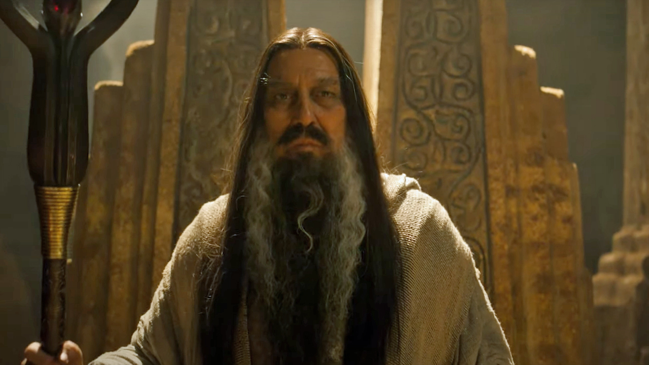 Ciaran Hinds' unnamed wizard stands with his staff in The Rings of Power season 2