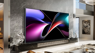 The Hisense 116UX TV on a wall in a very big and luxurious room