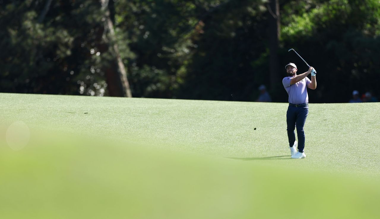 Tyrrell Hatton hits a shot from the fairway