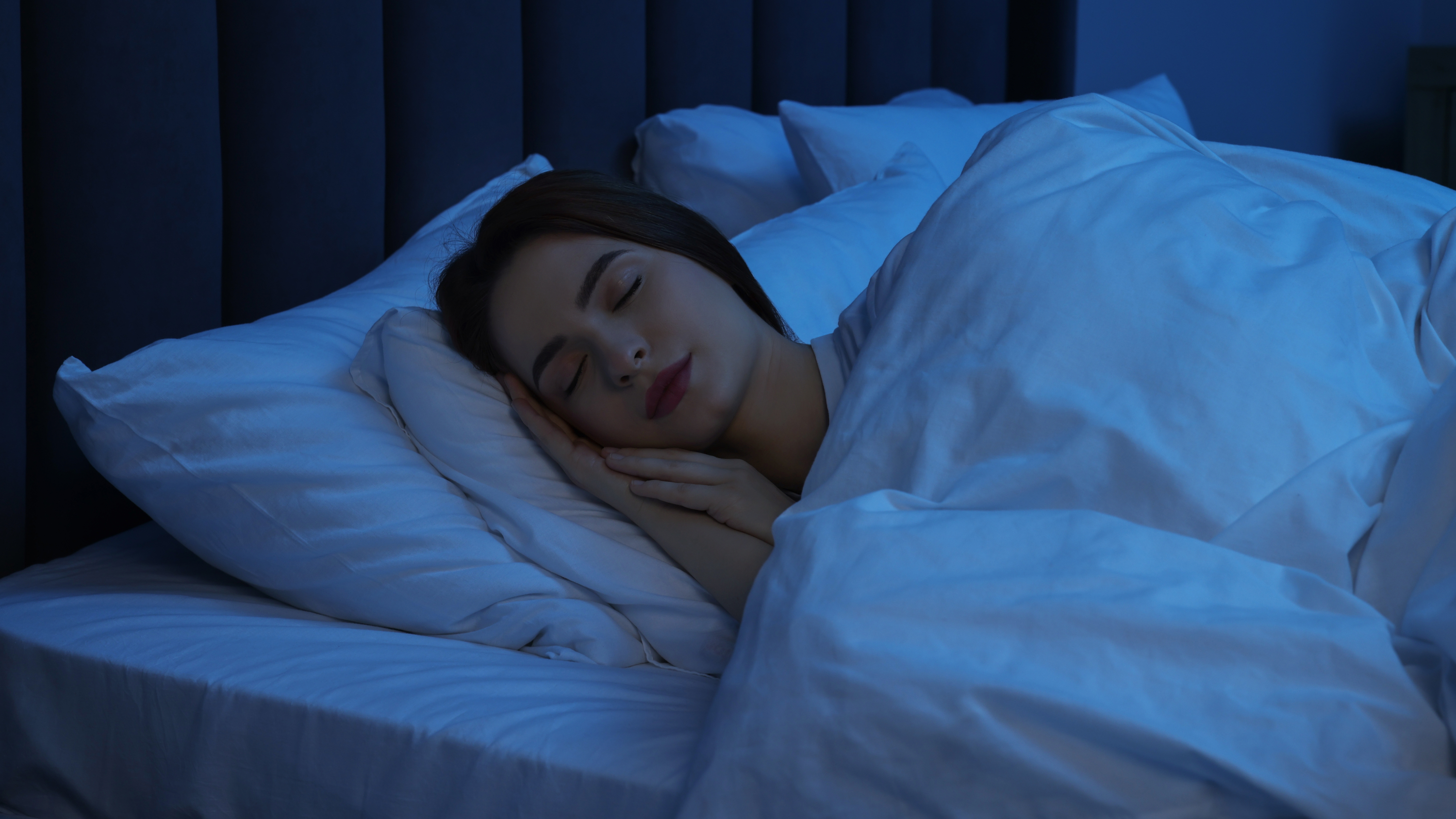a woman sleeping in bed