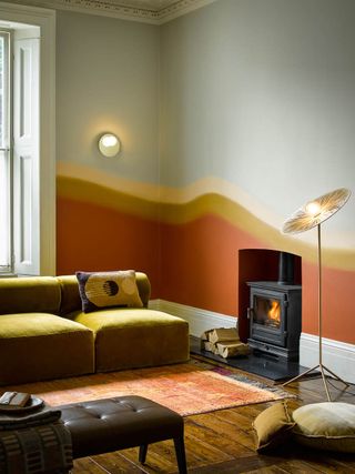 Gradual paint effect on living room wall, in Spring Thaw, Milan, Maple Sugar, and Rust are subtly enhanced by rug and surrounding decor