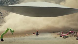 A flying saucer chasing a person on horseback in Nope.