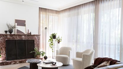 A living room with hidden curtain rod brackets
