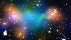 A composite image showing the distribution of dark matter, galaxies, and hot gas in the core of the merging galaxy cluster Abell 52. The blue areas show regions with the most mass; dark matter makes up most of this mass.