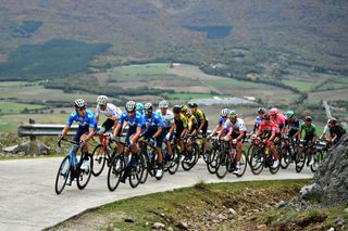 LEKUNBERRI SPAIN OCTOBER 21 Carlos Verona Quintanilla of Spain and Movistar Team Luis LeonSanchez Gil of Spain and Astana Pro Team Marc Soler Gimenez of Spain and Movistar Team Alejandro Valverde Belmonte of Spain and Movistar Team Enric Mas Nicolau of Spain and Movistar Team White Best Young Jersey Johan Esteban Chaves Rubio of Colombia and Team Mitchelton Scott Mikel Nieve Ituralde of Spain and Team Mitchelton Scott Rui Alberto Faria Da Costa of Portugal and UAE Team Emirates David Gaudu of France and Team Groupama FDJ Primoz Roglic of Slovenia and Team Jumbo Visma Red Leader Jersey Sepp Kuss of The United States and Team Jumbo Visma Polka Dot Mountain Jersey Richard Carapaz of Ecuador and Team INEOS Grenadiers Green Points Jersey Peloton Landscape during the 75th Tour of Spain 2020 Stage 2 a 1516km stage from Pamplona to Lekunberri lavuelta LaVuelta20 La Vuelta on October 21 2020 in Lekunberri Spain Photo by David RamosGetty Images