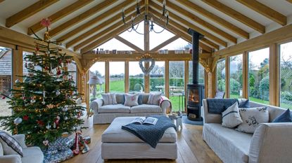 garden room with wooden flooring and grey sofa