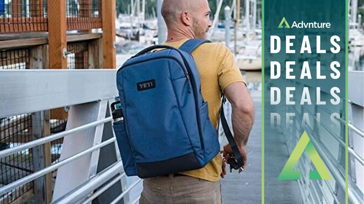 Man walking wearing Yeti Crossroad Backpack 23