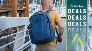 Man walking wearing Yeti Crossroad Backpack 23