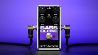 An Electro-Harmonix Bass Clone chorus pedal with two cables plugged into it.