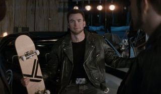 Chris Evans gestures with a skateboard in his hands in Scott Pilgrim vs The World.
