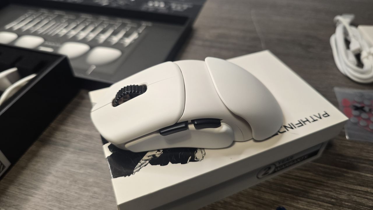 Orbital Pathfinder gaming mouse with various attachments.