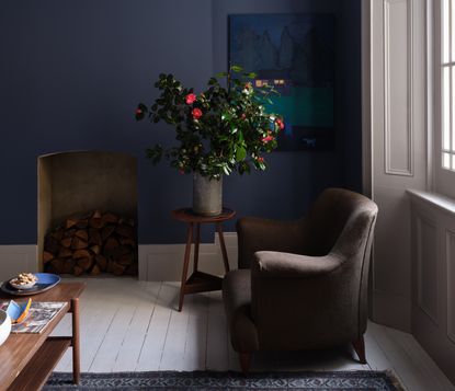 A living room painted in a deep blue 