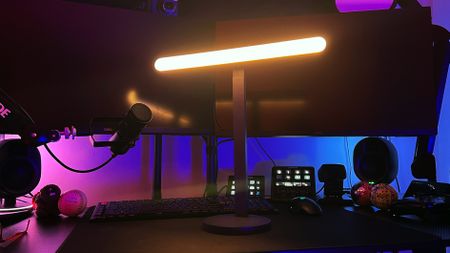 Logitech Litra Beam set up on a dark streaming desk