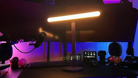 Logitech Litra Beam set up on a dark streaming desk