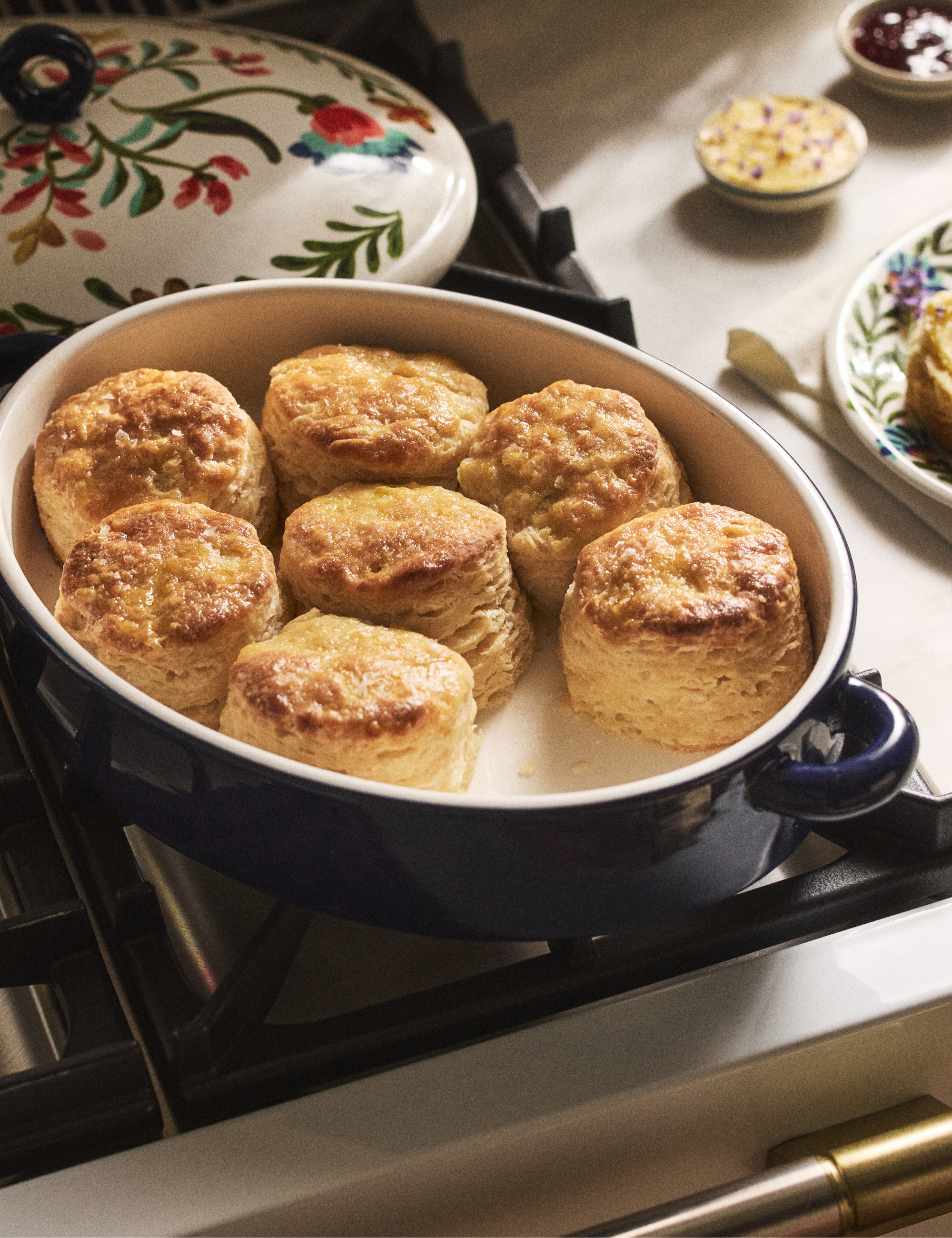 Freshly baked biscuits nestled inside a vintage-inspired botanical-motif stoneware braiser from Molly Yeh's new Anthropologie collaboration
