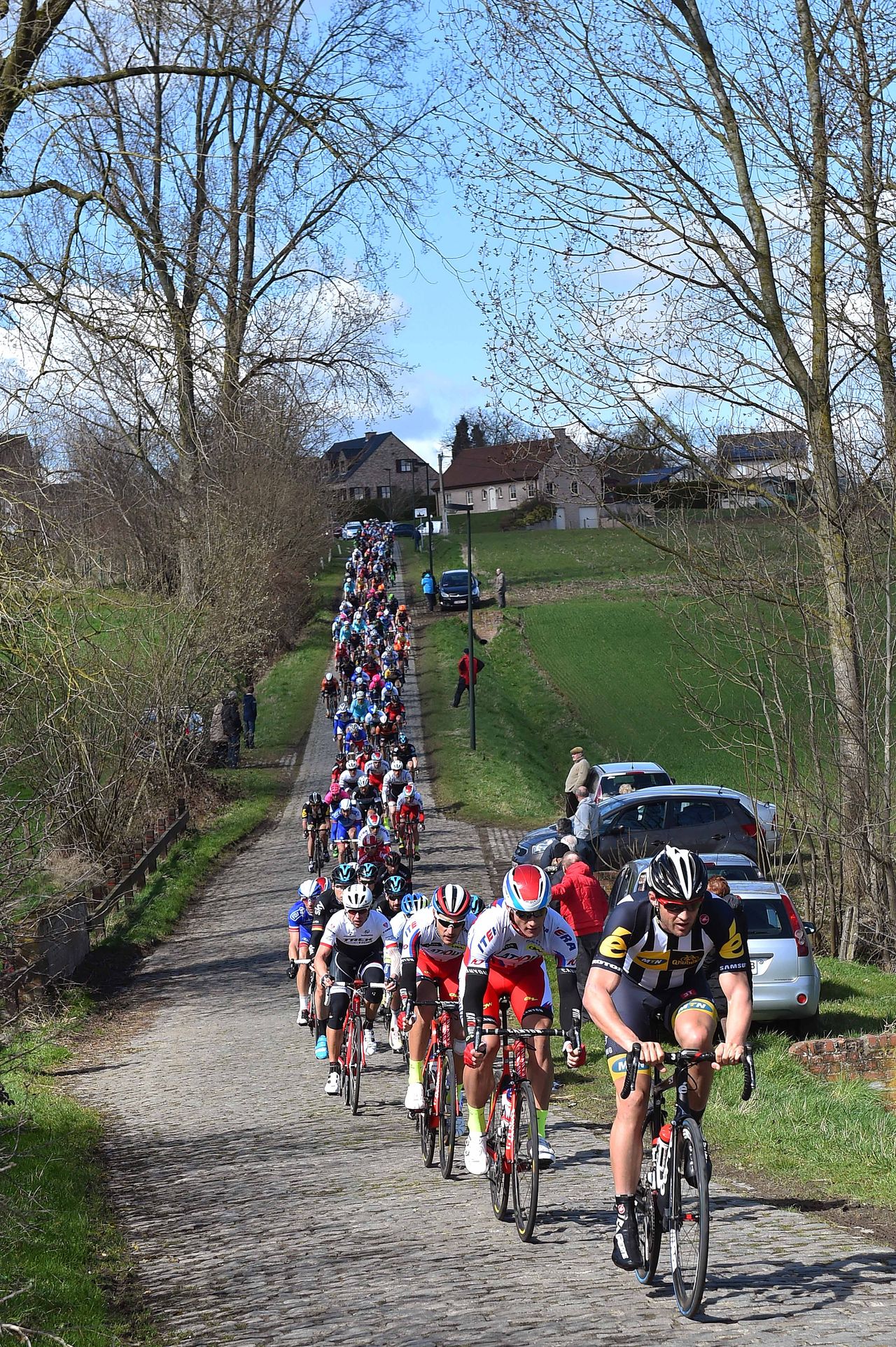 The peloton strung out