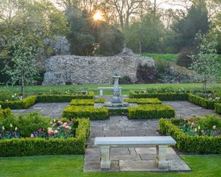 spring garden with blossom tulips and box parterre Benington Lordship