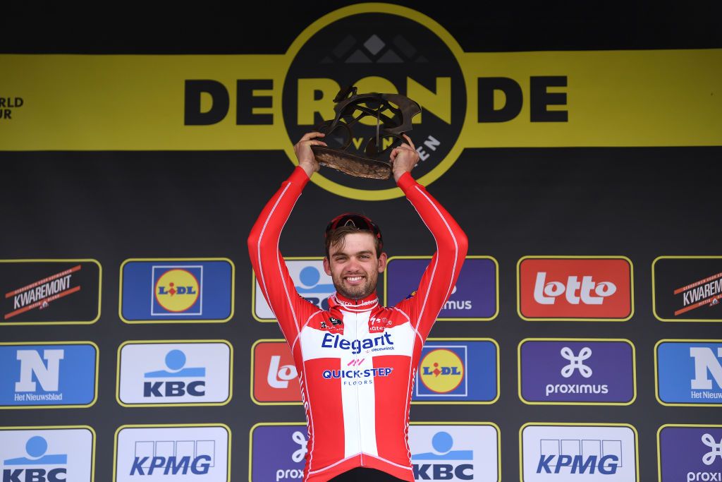 OUDENAARDE BELGIUM APRIL 04 Podium Kasper Asgreen of Denmark and Team Deceuninck QuickStep Celebration during the 105th Ronde van Vlaanderen Tour of Flanders 2021 Mens Elite a 2515km race from Antwerp to Oudenaarde Trophy RVV21 rondevanvlaanderen tourofflanders on April 04 2021 in Oudenaarde Belgium Photo by Tim de WaeleGetty Images