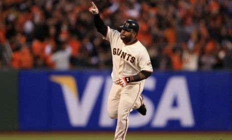 Pablo Sandoval rounds the bases after hitting a solo home run during Game 1 of the World Series against the Detroit Tigers.