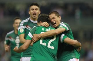 Raul Jimenez (centre) celebrates with his team-mates after scoring against Panama in October 2013.