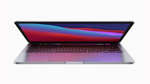 Image shows a partially open MacBook Pro M1.- MacBook Pro 13-inch (2020) review
