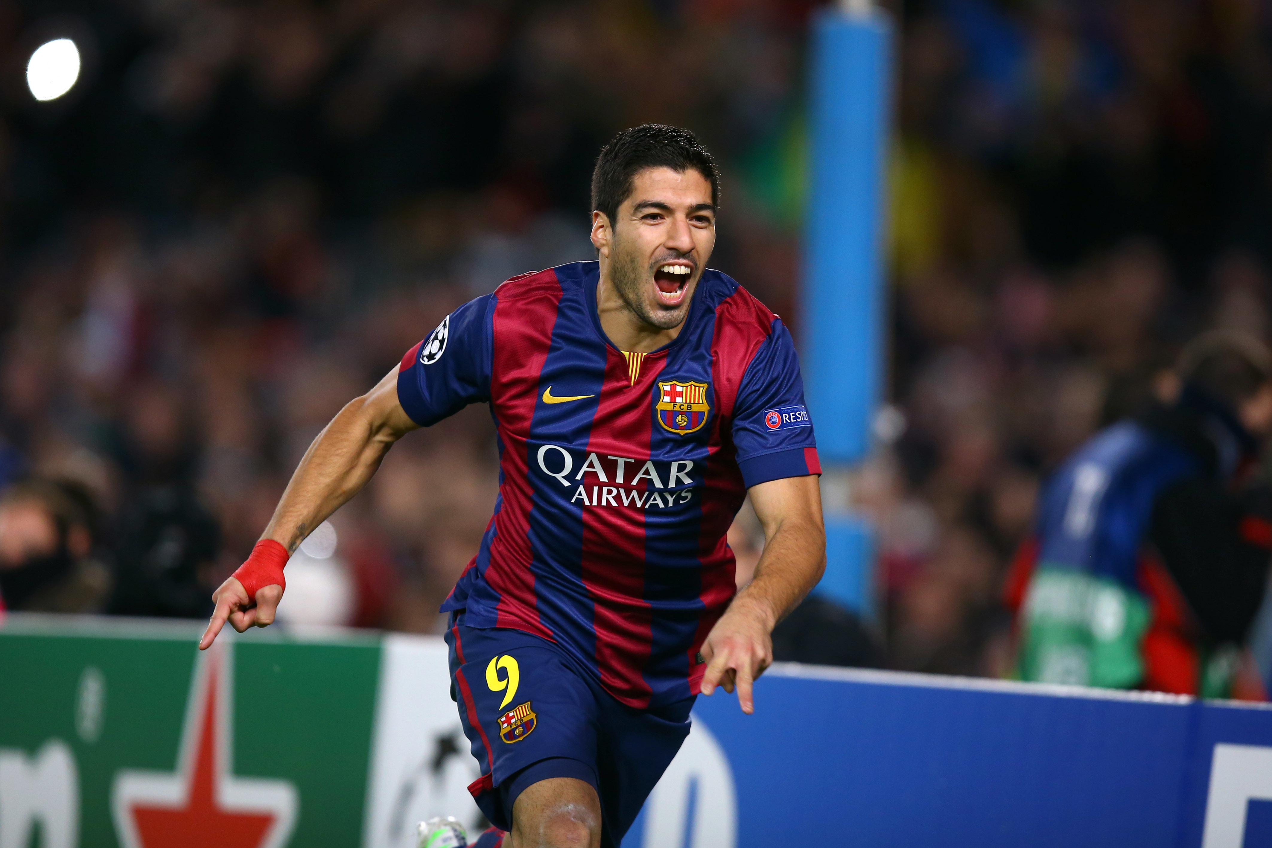 Luis Suarez celebrates after scoring for Barcelona against Paris Saint-Germain in the Champions League in December 2014.