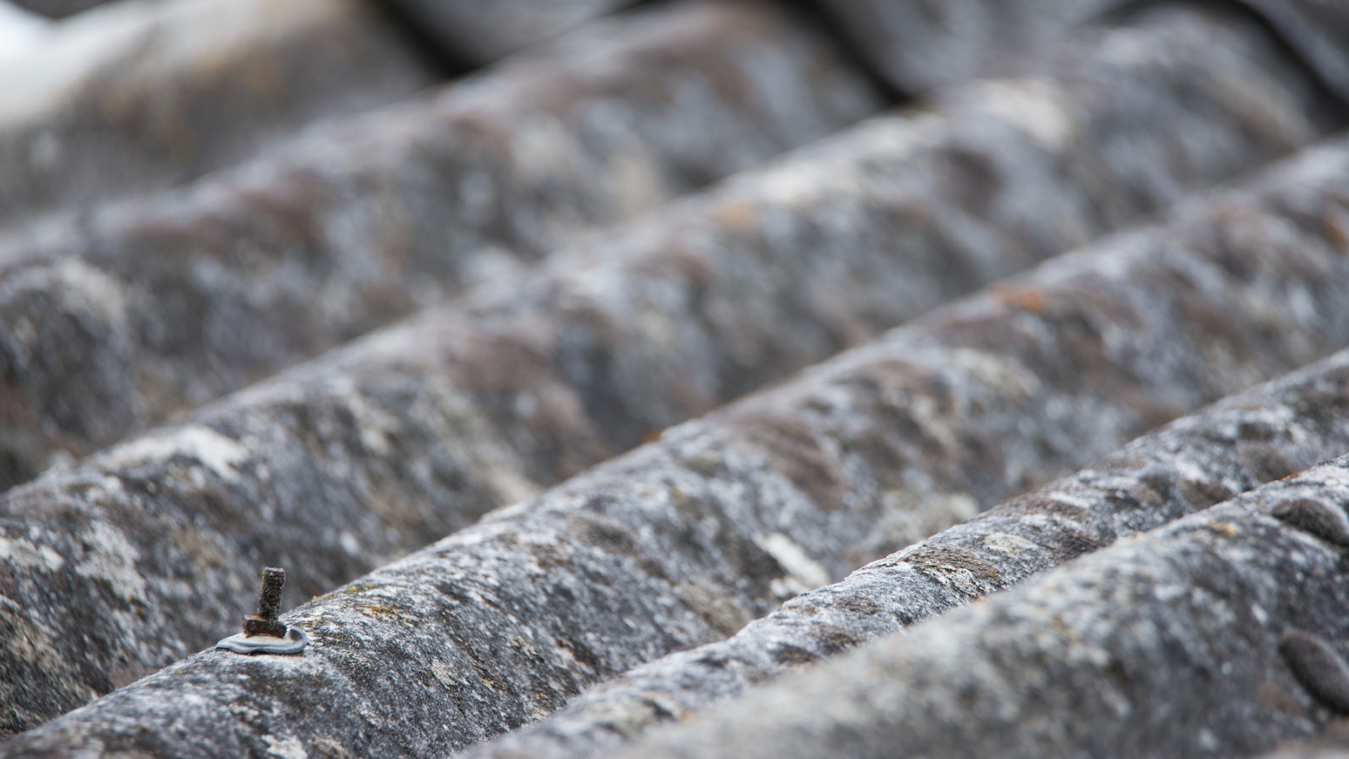 Close-up shot of an asbestos roof from an old building.