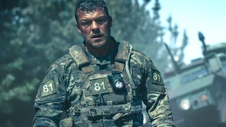 a soldier in uniform in the wilderness