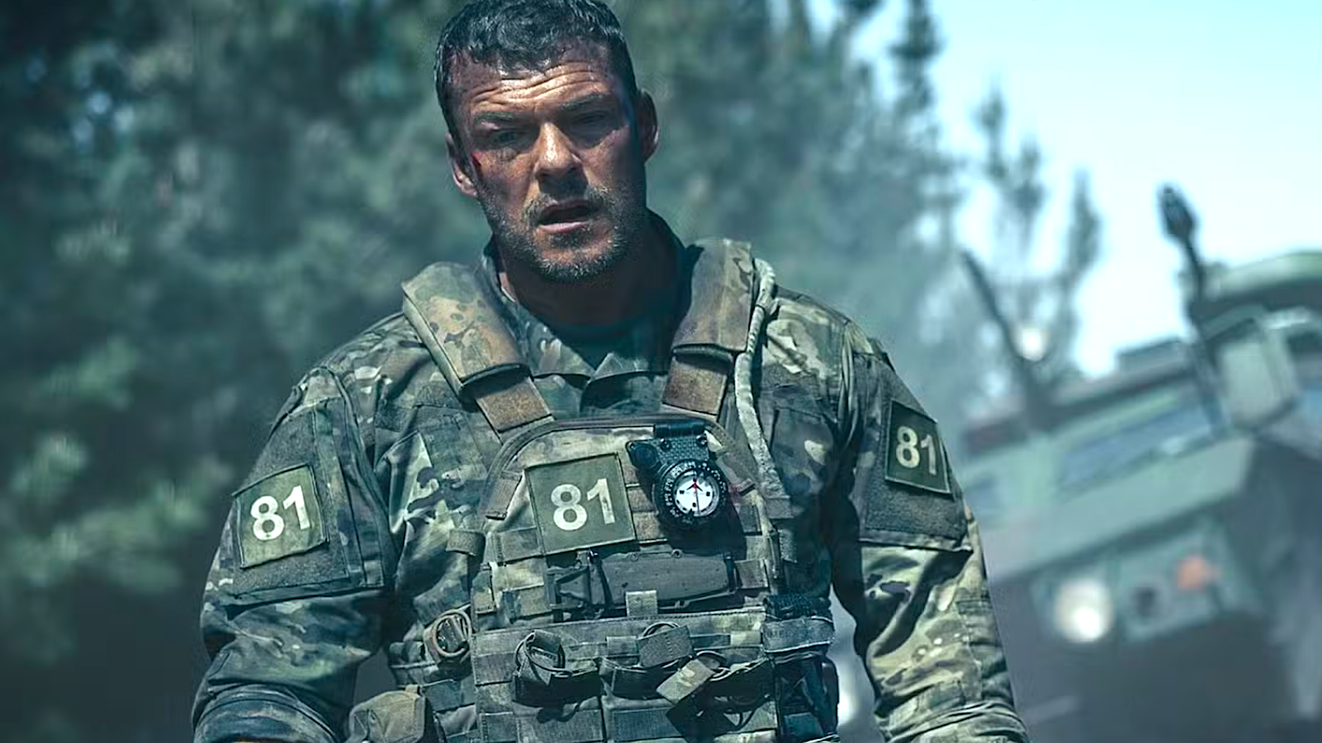 a soldier in uniform in the wilderness