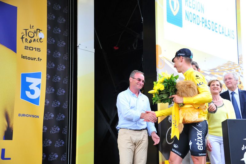 A congratulatory handshake from Bernard Hinault for Tony Martin