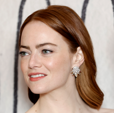 Emma stone stuns in a plunging silk gown while attending a UK Gala Screening of "Poor Things." 