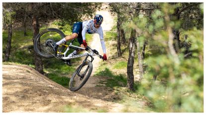 Tom Pidcock tabletopping his new Pinarello Dogma XC mountain bike