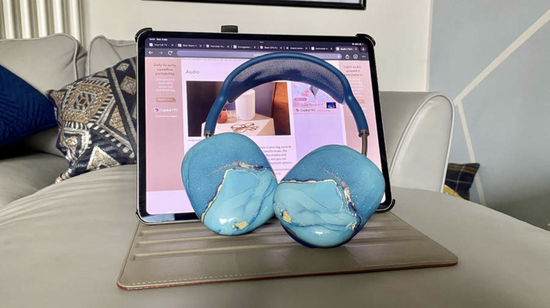 Apple AirPods Max in front of a MacBook Pro laptop