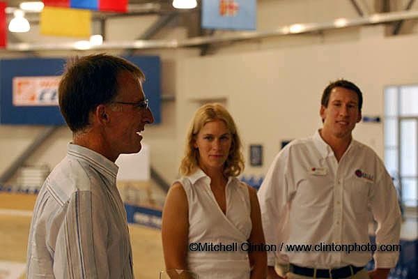 Dr. Brent Kay of the OUCH Sports Medical Clinic talks to the group about his long history with Sarah as Sarah and Andy Sparks look on.