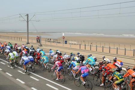 The Gent-Wevelgem peloton rolls along the seaside.