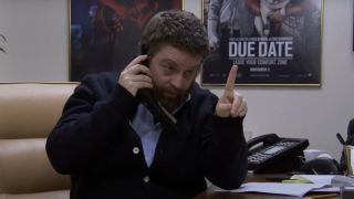 Zach Galifianakis talking on a stapler in the SNL Digital Short "Zach Looks for a New Assistant"