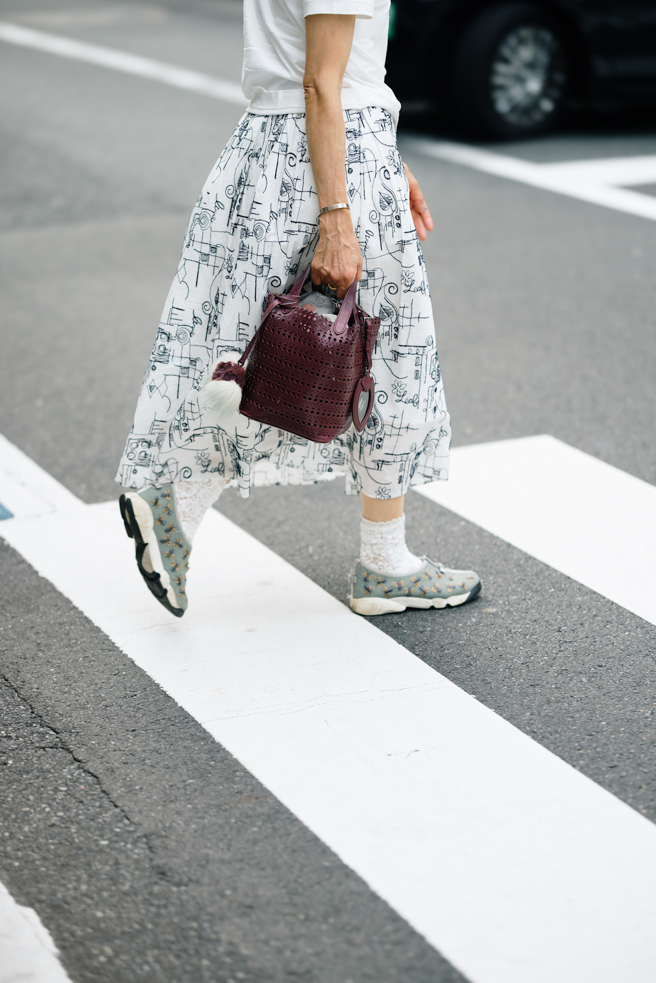 woman wearing slip-on sneakers