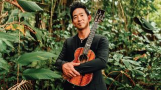 Jake Shimabukuro with one of his custom Casey Kamaka tenor ukuleles