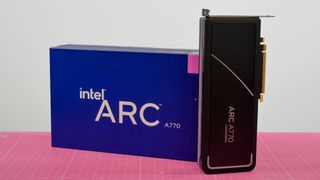 An Intel Arc A770 on a desk with a pink mat underneath