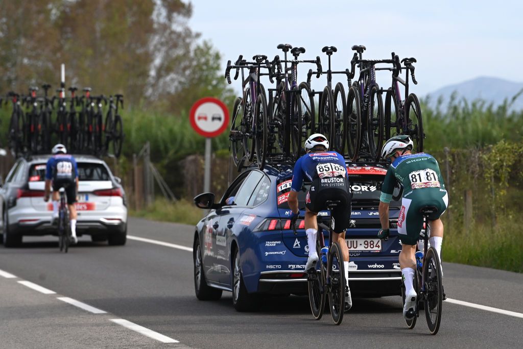 OLIVA SPAIN SEPTEMBER 01 Robbe Ghys of Belgium helps to Kaden Groves of Australia and Team AlpecinDeceuninck Green Points Jersey dropped from the peloton during the 78th Tour of Spain 2023 Stage 7 a 2008km stage from Utiel to Oliva UCIWT on September 01 2023 in Oliva Spain Photo by Tim de WaeleGetty Images